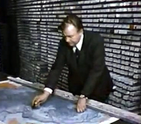 Surrounded by stacks of core samples from the Atlantic ocean floor, oceanographer and marine geologist Bruce Heezen demonstrates features of the continental shelf.